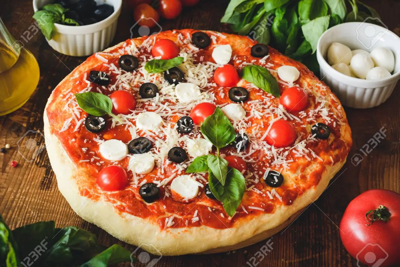 Tomato Black olive pizza
